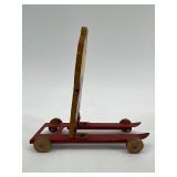 Vintage Wolverine Tin Skier Toy