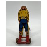 Vintage Wolverine Tin Skier Toy
