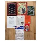 Collection of British Royalty Memorabilia Featuring Coins, Books, and T-Shirt
