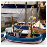 Collection of 13 Handcrafted Model Boats and Ships with Unique Designs
