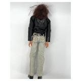 Collection of 4 Vintage Ken Dolls with Varied Outfits including Harley Davidson