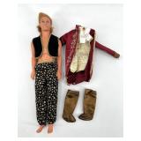 Vintage Ken Doll with Star-Patterned Pants and Accessories