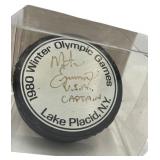1980 LAKE PLACID OLYMPICS HOCKEY PUCK // SIGNED BY USA CAPTAIN MIKE ERUZIOE