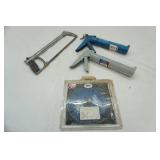 caulking guns, hacksaw & blue concrete blade