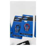 Collection of Bicycle Maintenance Tools Including Park Tool Wrenches and Brushes