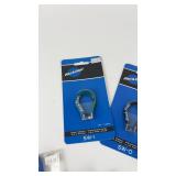Collection of Bicycle Maintenance Tools Including Park Tool Wrenches and Brushes