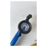 Collection of Bicycle Repair Tools with Tire Gauges and Accessories