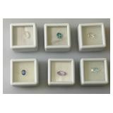 Misc. (Lab Created) Gems (In Protective Sleeves) Including 1.1Ct Pink Amethyst, 1.14 CT Blue Zircon, 1.17 Ct. Sky Blue Topaz, 1.5 CT White Topaz, 2.09 CT Blue Kyadite & More