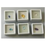 Misc. (Lab Created) Gems (In Protective Sleeves) Including 1.1Ct Pink Amethyst, 1.14 CT Blue Zircon, 1.17 Ct. Sky Blue Topaz, 1.5 CT White Topaz, 2.09 CT Blue Kyadite & More
