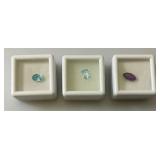 Misc. (Lab Created) Gems (In Protective Sleeves) Including 1.1Ct Pink Amethyst, 1.14 CT Blue Zircon, 1.17 Ct. Sky Blue Topaz, 1.5 CT White Topaz, 2.09 CT Blue Kyadite & More