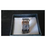 Silver Colored Ring Band with Wave Design.