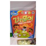 Child Learning Melissa and Doug Scavenger Hunt, Zingo, UNO, and many more.