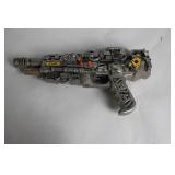 Silver-Colored Toy Ray Gun with Steampunk Design