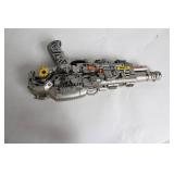 Silver-Colored Toy Ray Gun with Steampunk Design