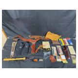 Collection of Hunting and Outdoor Gear with Leather Holster and Tools