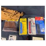 Collection of Hunting and Outdoor Gear with Leather Holster and Tools