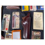 Collection of Hunting and Outdoor Gear with Leather Holster and Tools