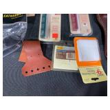 Collection of Hunting and Outdoor Gear with Leather Holster and Tools