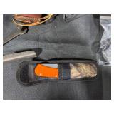 Collection of Hunting and Outdoor Gear with Leather Holster and Tools