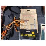 Collection of Hunting and Outdoor Gear with Leather Holster and Tools