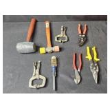Collection of Hand Tools Including Mallets, Pliers, and Clamps