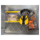 Safety Gear Collection Including Goggles, Ear Protection, and Pipe Clamp