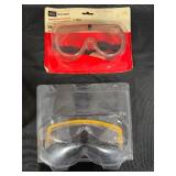 Safety Gear Collection Including Goggles, Ear Protection, and Pipe Clamp
