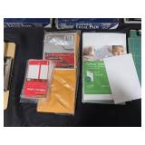 Collection of Office and School Supplies Including Notebooks, Legal Pads, and Cutting Mats