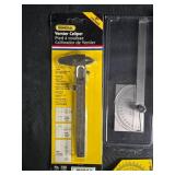 Collection of Drafting Tools including Vernier Caliper and Protractor