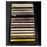 Collection of Music Cassettes and CDs in Case Logic Cases