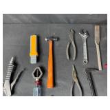 Collection of Various Hand Tools Including Pliers and Hammers