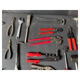 Collection of Various Hand Tools Including Pliers and Hammers