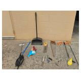 Assortment of Hand Tools Including Saws, Clamps, and Scrapers