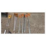 Assortment of Hand Tools Including Saws, Clamps, and Scrapers