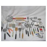 Lot of Vintage Baking, Serving & Cutting Utensils, Strainers, Rolling Pin, Beaters, and more.