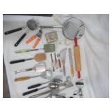 Lot of Vintage Baking, Serving & Cutting Utensils, Strainers, Rolling Pin, Beaters, and more.