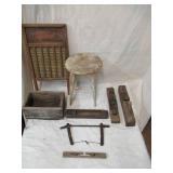 Vintage lot of primitive pieces. Milking stool, wood box, planes, saw, wash board.