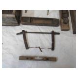 Vintage lot of primitive pieces. Milking stool, wood box, planes, saw, wash board.
