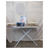 Lot of Ironing Items. New Iron in box, Ironing Board, New Pad and more