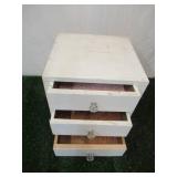 Vintage painted wood set of table top dovetailed drawers with glass knobs.