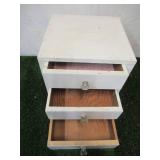 Vintage painted wood set of table top dovetailed drawers with glass knobs.
