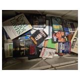 Lots of books, DVDs, and magazines. Box not included in this sale