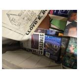 Lots of books, DVDs, and magazines. Box not included in this sale