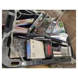A 20"W Tote full of over 200 combined of DVDs, CDs, and Cassettes