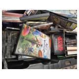 A 20"W Tote full of over 200 combined of DVDs, CDs, and Cassettes