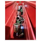 Collection of Various Socket Tools in a Red Storage Bin