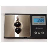 Elegant Sterling Silver Pendant with Black Stones