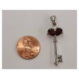 Sterling Silver Key Pendant with Red Gemstones