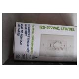 Pair of In-Wall Light Switches: Tork A512HHW and Commercial Electric Smart Light Switch