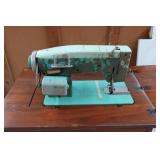 White Zigzag Stitcher Sewing Machine in Wood Cabinet